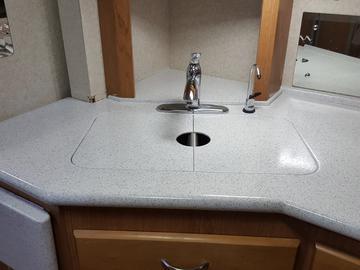 Damaged Corian Style RV Countertop Repaired and Resurfaced with a New Stone Accent Epoxy Finish 